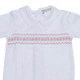 PALE PINK HAND-SMOCKED BABYGROW