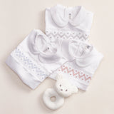 PALE BLUE ARACELI HAND-SMOCKED BABYGROW